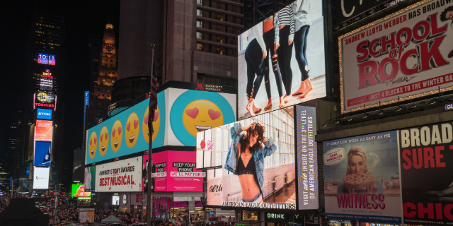 out-of-home-advertising billboards on busy night street