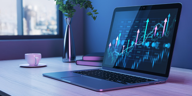 laptop with chart and arrows on screen